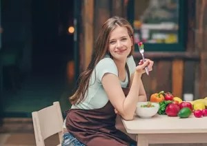 Person eating strawberry